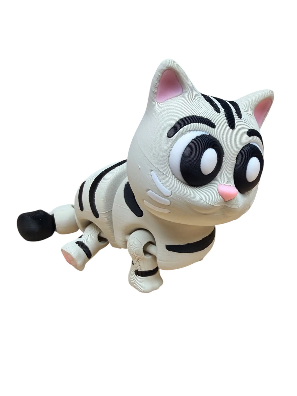 Toy cat with black stripes on a white background